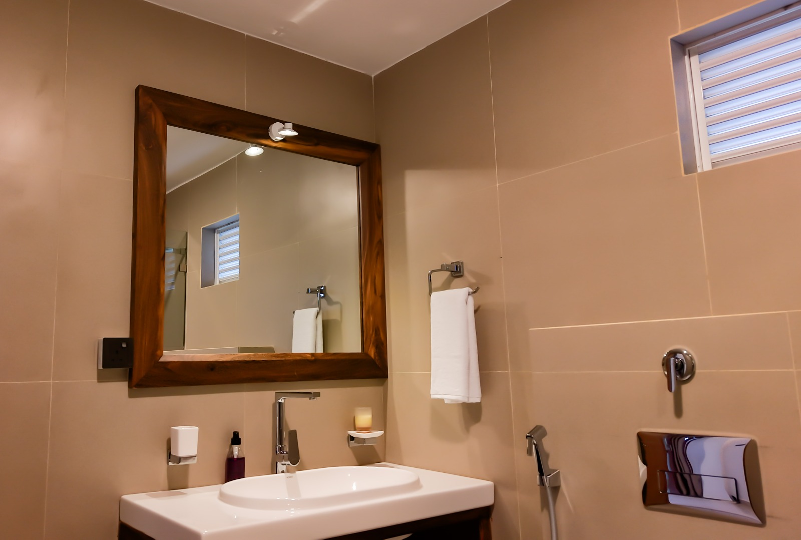 Bathroom vanity with wooden-framed mirror